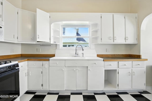 302 N Market St, Van Wert, OH 45891 - kitchen featuring open shelves, electric range, and white cabinets