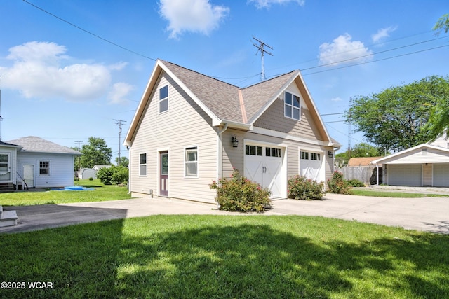 302 N Market St, Van Wert, OH 45891 - view of front of home with roof with shingles, a garage, and concrete driveway