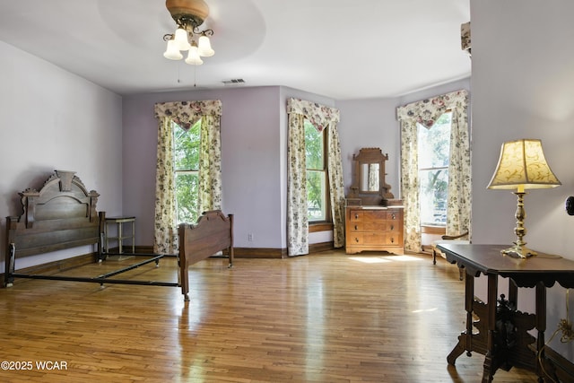 302 N Market St, Van Wert, OH 45891 - living area featuring wood finished floors, healthy amount of natural light, and a ceiling fan