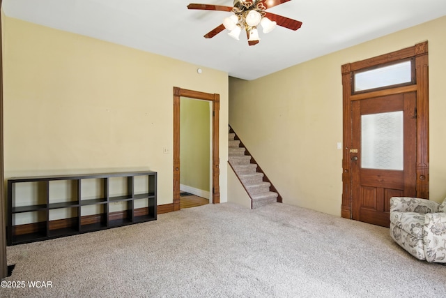 302 N Market St, Van Wert, OH 45891 - entrance foyer with stairs, carpet flooring, and a ceiling fan