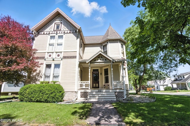 302 N Market St, Van Wert, OH 45891 - victorian house with covered porch and a front lawn