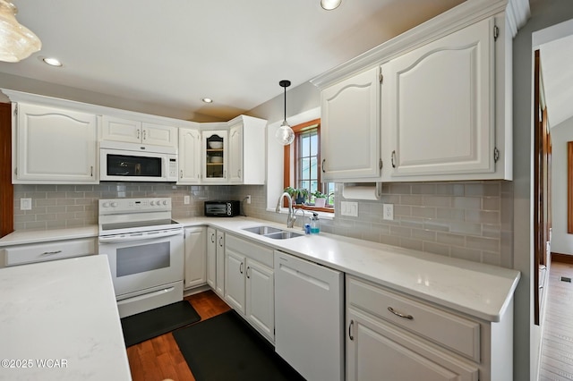 4860 Wenatchi Trl, Lima, OH 45805 - kitchen with white appliances, white cabinetry, dark wood-style flooring, decorative backsplash, and recessed lighting