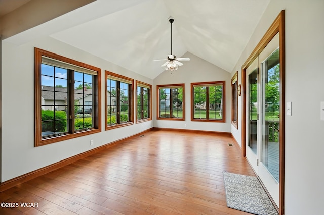 4860 Wenatchi Trl, Lima, OH 45805 - unfurnished sunroom featuring healthy amount of natural light, vaulted ceiling, and hardwood / wood-style floors
