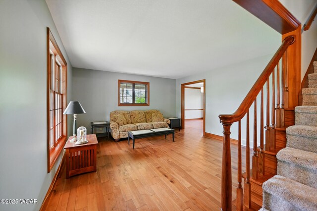 4860 Wenatchi Trl, Lima, OH 45805 - living area featuring stairs and light wood-type flooring