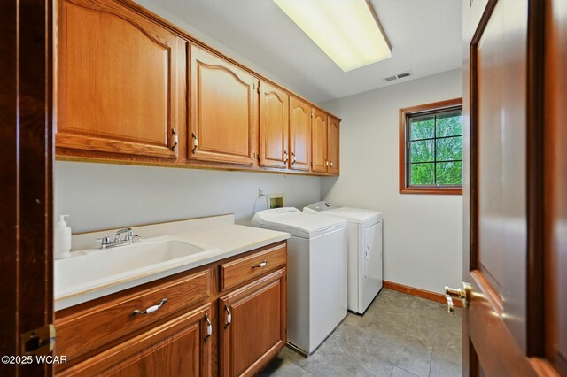 4860 Wenatchi Trl, Lima, OH 45805 - laundry area with cabinet space and independent washer and dryer