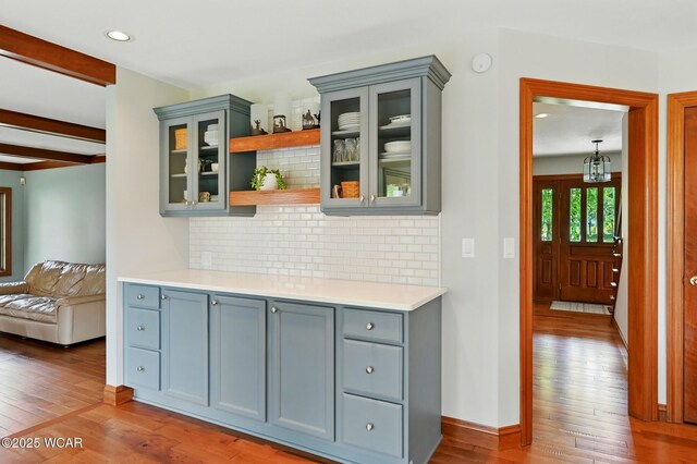 4860 Wenatchi Trl, Lima, OH 45805 - bar with hardwood / wood-style floors, backsplash, and recessed lighting