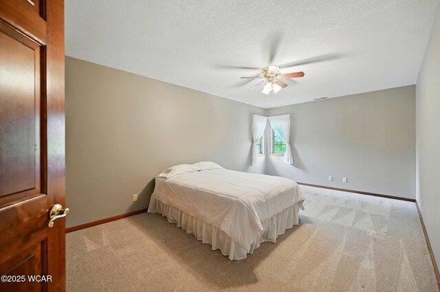 4860 Wenatchi Trl, Lima, OH 45805 - bedroom featuring light carpet and a ceiling fan