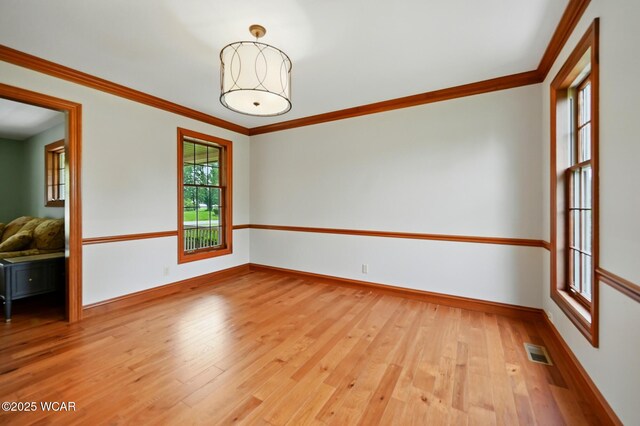 4860 Wenatchi Trl, Lima, OH 45805 - unfurnished room featuring light wood-style flooring and crown molding