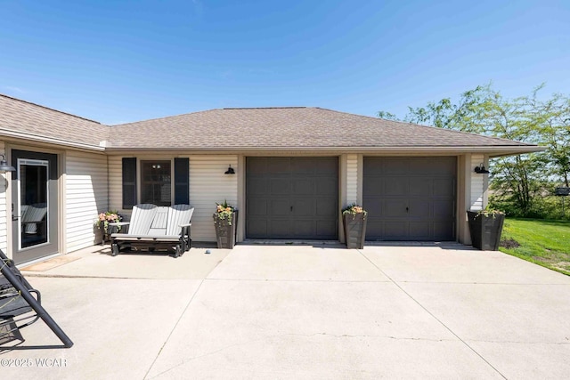 16070 Rd S, Columbus Grove, OH 45830 - view of front of home featuring driveway, roof with shingles, and a garage