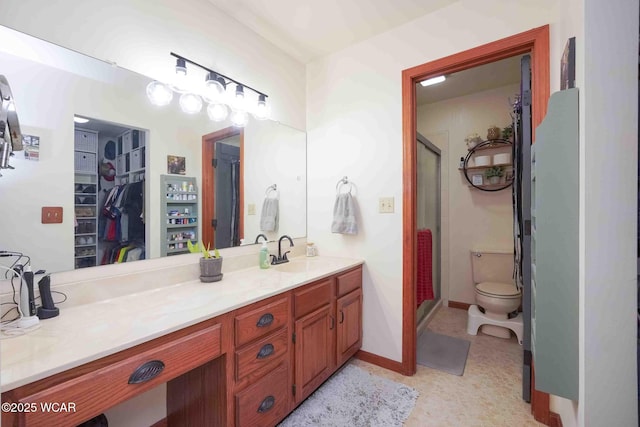 16070 Rd S, Columbus Grove, OH 45830 - full bathroom featuring a spacious closet, double vanity, a stall shower, toilet, and baseboards