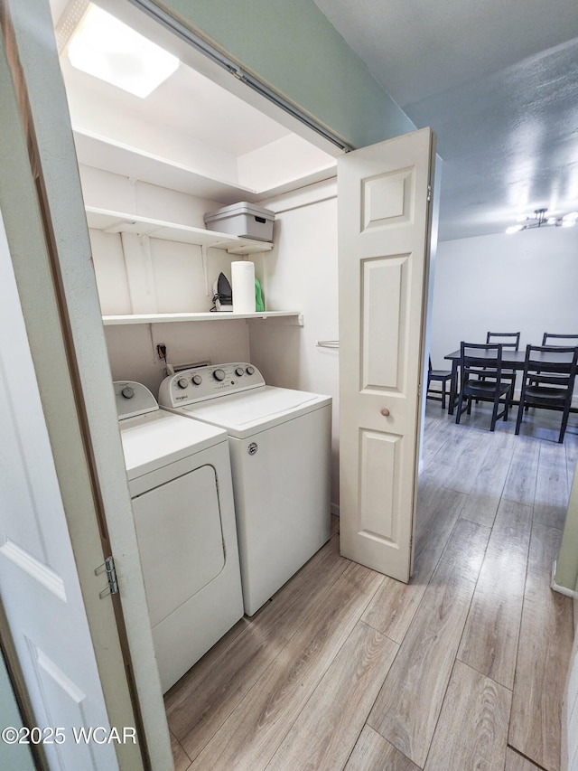 2028 Greendale Ave, Findlay, OH 45840 - laundry area featuring washer and clothes dryer and light wood-style floors