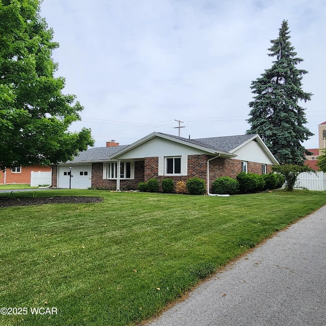2028 Greendale Ave, Findlay, OH 45840 - ranch-style home featuring brick siding, a garage, and a chimney