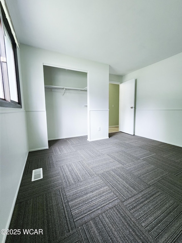 2028 Greendale Ave, Findlay, OH 45840 - unfurnished bedroom with carpet floors, a closet, and baseboards