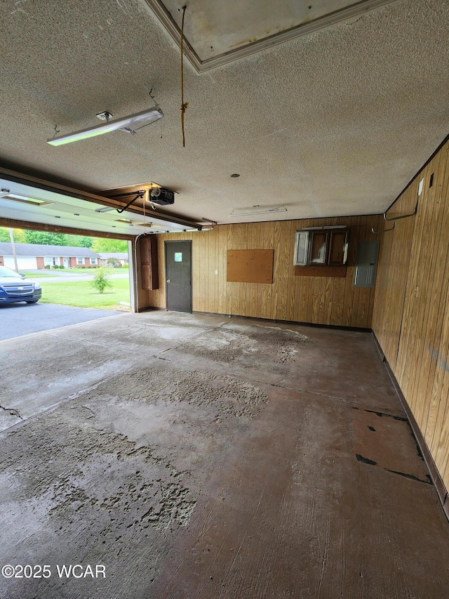 2028 Greendale Ave, Findlay, OH 45840 - garage with a garage door opener and wood walls