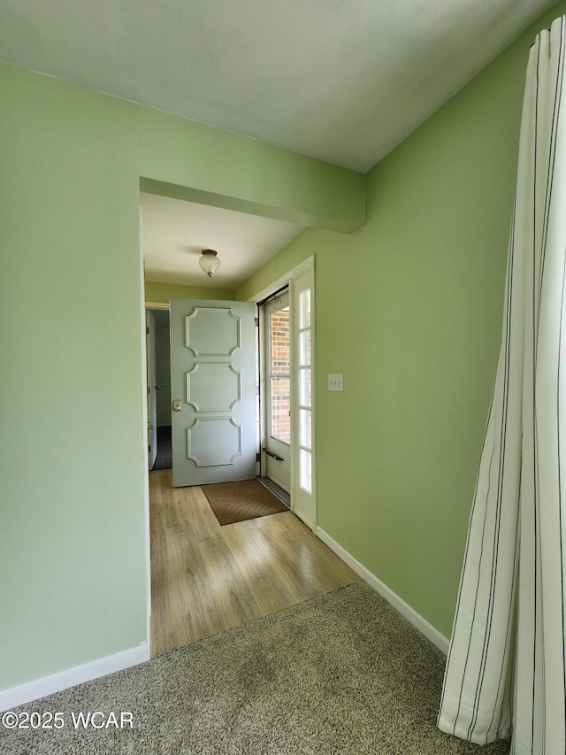 2028 Greendale Ave, Findlay, OH 45840 - entryway featuring baseboards, carpet, and wood finished floors