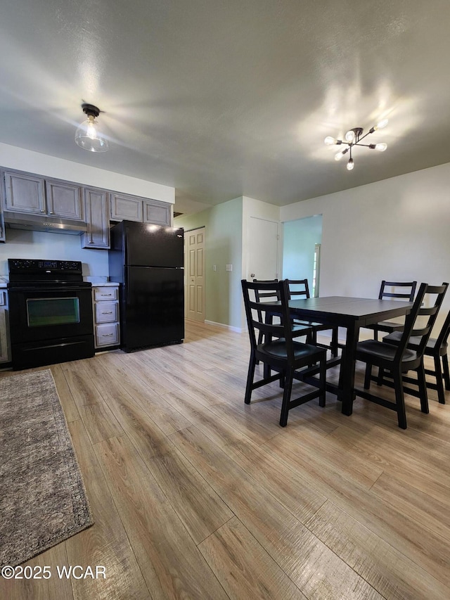2028 Greendale Ave, Findlay, OH 45840 - dining space featuring light wood-type flooring and baseboards