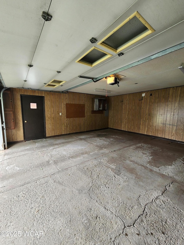 2028 Greendale Ave, Findlay, OH 45840 - garage with a garage door opener and wooden walls