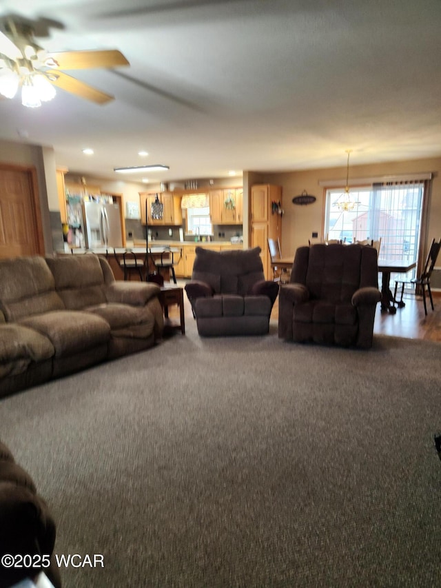 living area with a ceiling fan