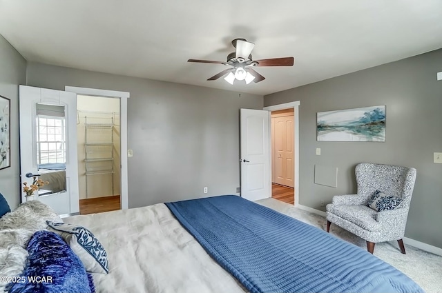 bedroom with carpet flooring, ceiling fan, and baseboards