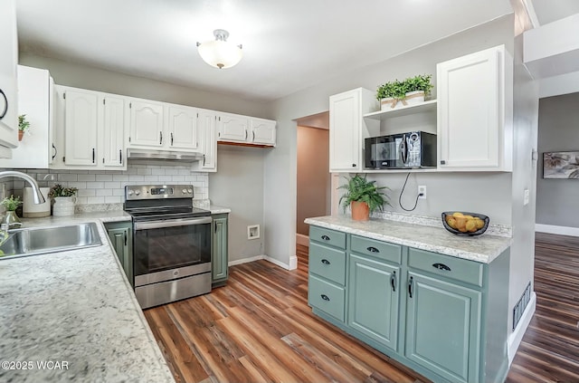 kitchen with stainless steel electric stove, under cabinet range hood, black microwave, open shelves, and a sink