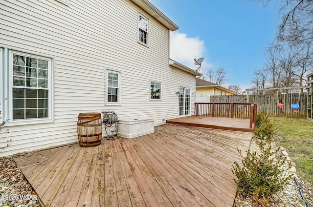 wooden terrace featuring fence