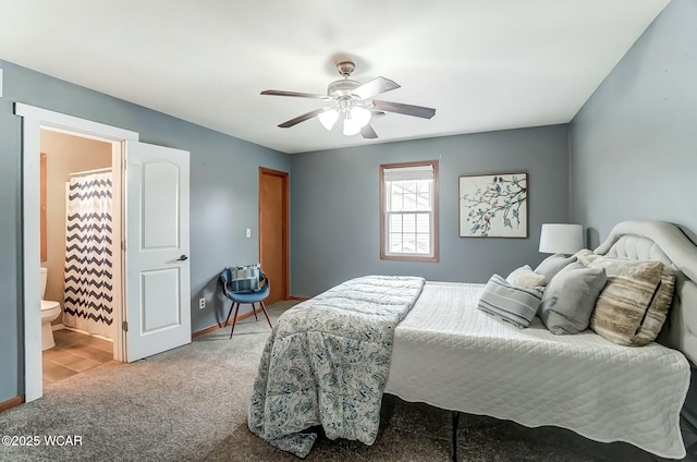 bedroom with ensuite bath, carpet, baseboards, and ceiling fan