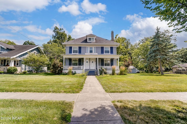 view of front of house featuring a front lawn and a porch