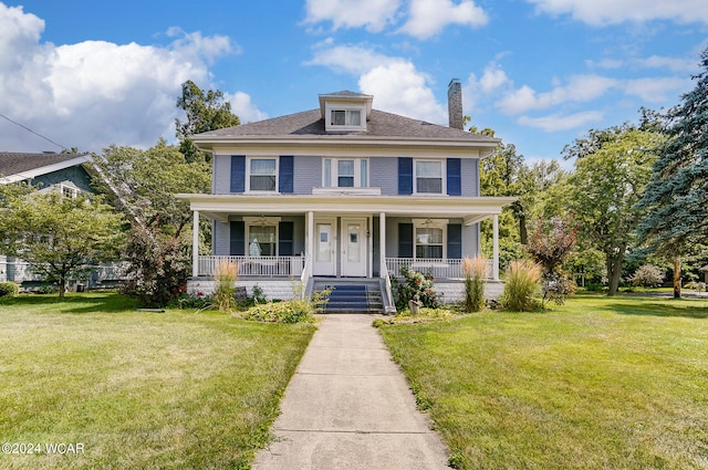 view of front of home featuring a porch and a front yard