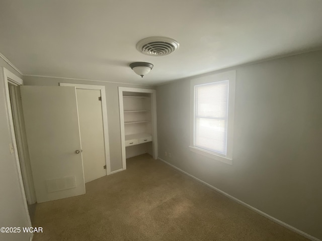 7110 State Route 66, Fort Loramie, OH 45845 - unfurnished bedroom featuring multiple closets and carpet flooring