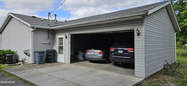209 Wagner St, Alger, OH 45812 - garage featuring concrete driveway and central AC