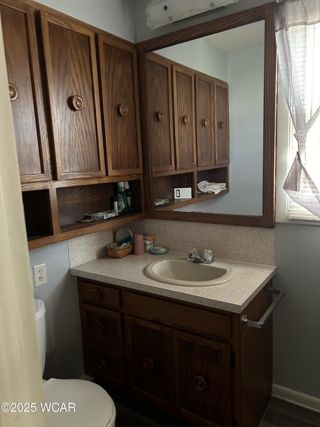 bathroom with vanity and toilet