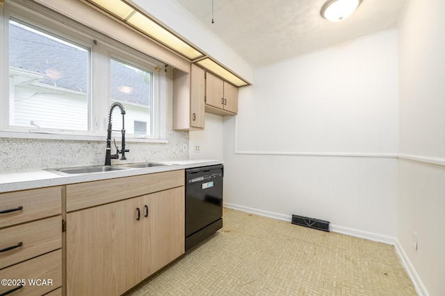 247 W State St, West Mansfield, OH 43358 - kitchen with dishwasher, light brown cabinets, a sink, and light countertops