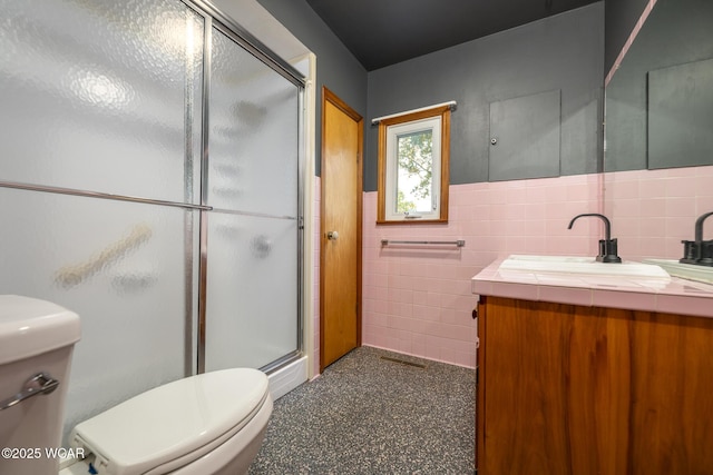 247 W State St, West Mansfield, OH 43358 - bathroom featuring toilet, a shower stall, vanity, and tile walls