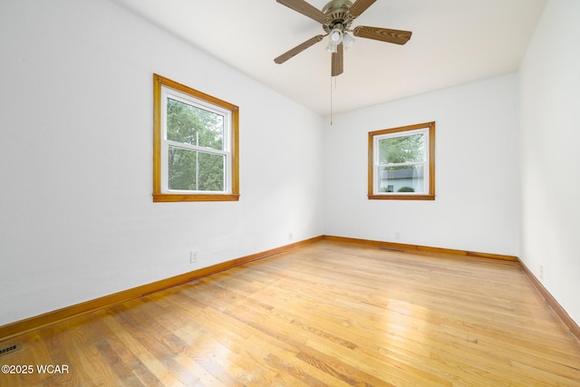 247 W State St, West Mansfield, OH 43358 - empty room with light wood-style floors, baseboards, and a ceiling fan
