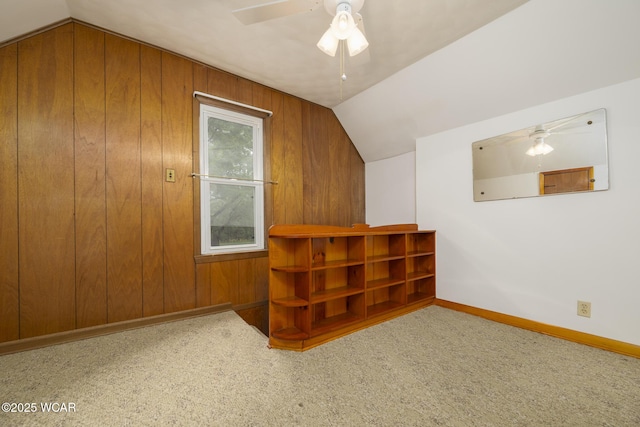 247 W State St, West Mansfield, OH 43358 - additional living space featuring ceiling fan, carpet, vaulted ceiling, baseboards, and wooden walls