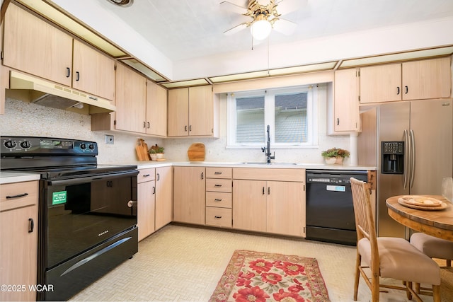 247 W State St, West Mansfield, OH 43358 - kitchen featuring black appliances, under cabinet range hood, a sink, and light brown cabinetry