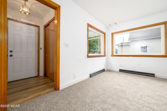 247 W State St, West Mansfield, OH 43358 - carpeted foyer entrance featuring baseboard heating and baseboards