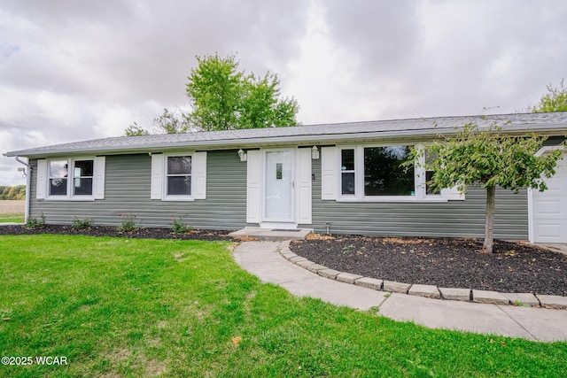 ranch-style home with a front lawn