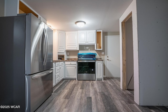 kitchen with stainless steel appliances, dark hardwood / wood-style floors, and white cabinets