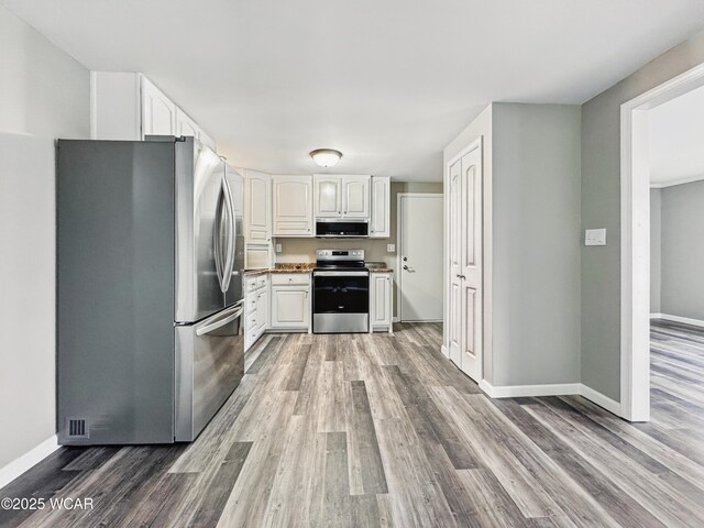 bathroom with vanity and hardwood / wood-style floors