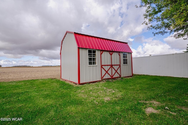 view of outbuilding with a lawn