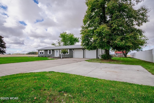 view of front of house featuring a garage and a front yard