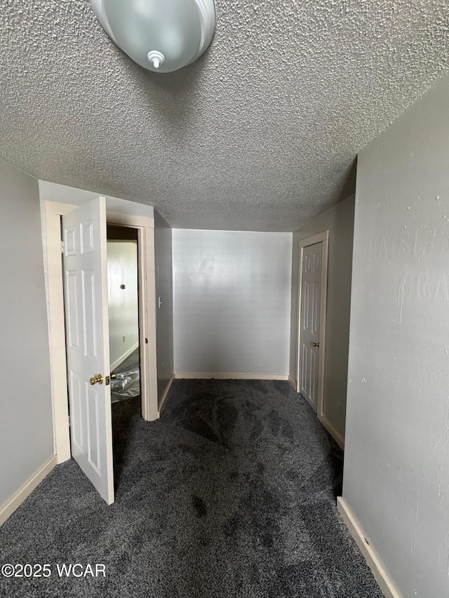 512 W N St, Kenton, OH 43326 - corridor with carpet, a textured ceiling, and baseboards