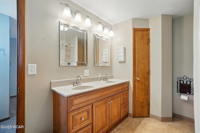 2432 Kunneke Ave, Lima, OH 45805 - bathroom featuring double vanity, tile patterned floors, and baseboards