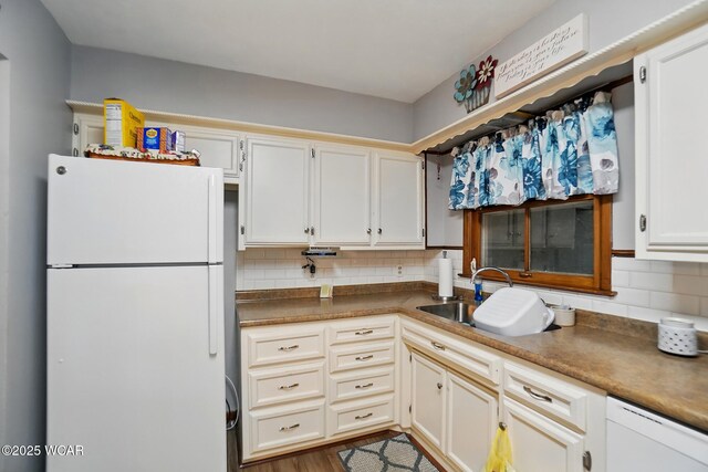 2432 Kunneke Ave, Lima, OH 45805 - kitchen featuring white appliances, a sink, decorative backsplash, dark countertops, and wood finished floors