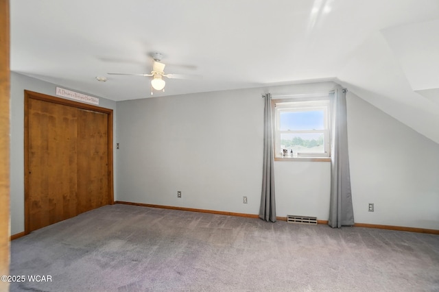 2432 Kunneke Ave, Lima, OH 45805 - unfurnished bedroom featuring carpet, lofted ceiling, baseboards, and ceiling fan