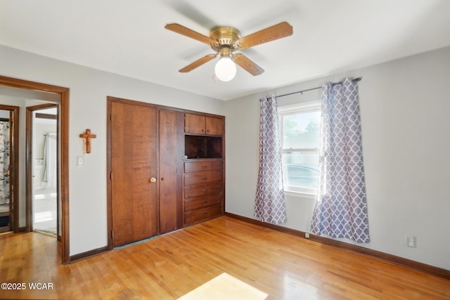 2432 Kunneke Ave, Lima, OH 45805 - unfurnished bedroom featuring light wood finished floors, baseboards, a closet, and a ceiling fan