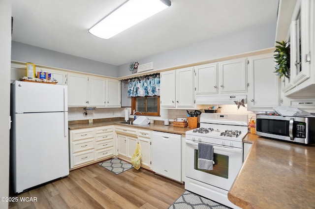 2432 Kunneke Ave, Lima, OH 45805 - kitchen featuring white appliances, a sink, backsplash, light wood finished floors, and white cabinets