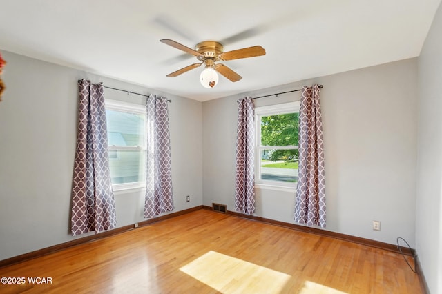 2432 Kunneke Ave, Lima, OH 45805 - spare room featuring wood finished floors, baseboards, and a ceiling fan