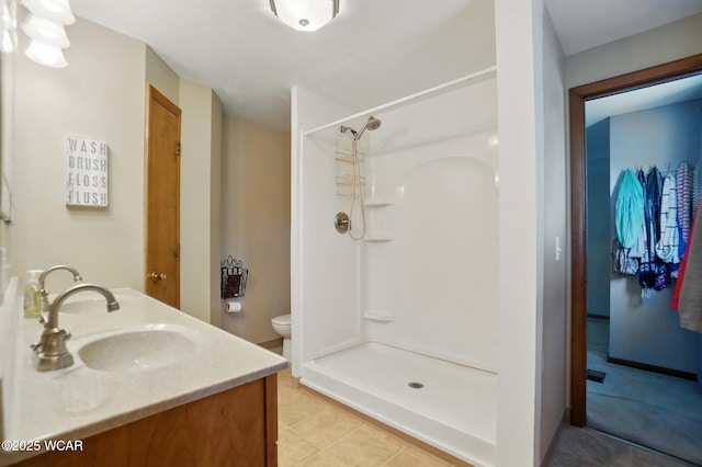 2432 Kunneke Ave, Lima, OH 45805 - full bathroom featuring a shower stall, toilet, and double vanity